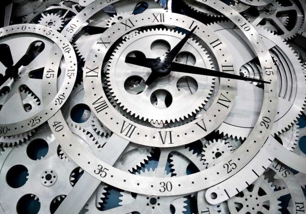 Close up of a silver clock face.