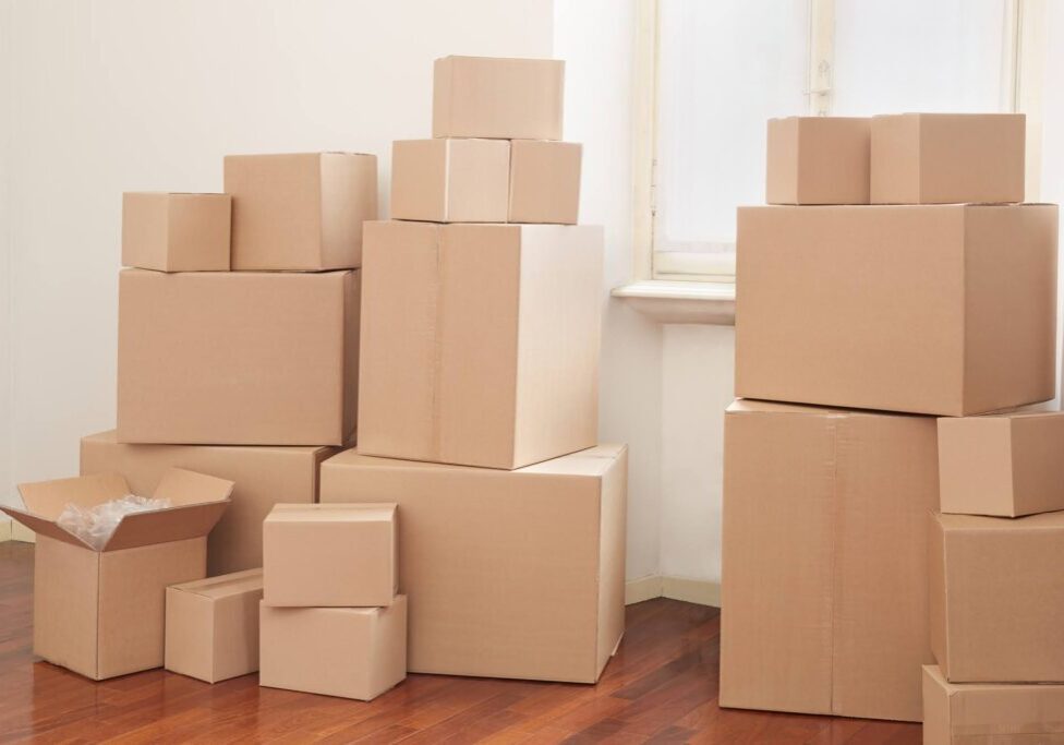 Cardboard boxes in apartment, moving day